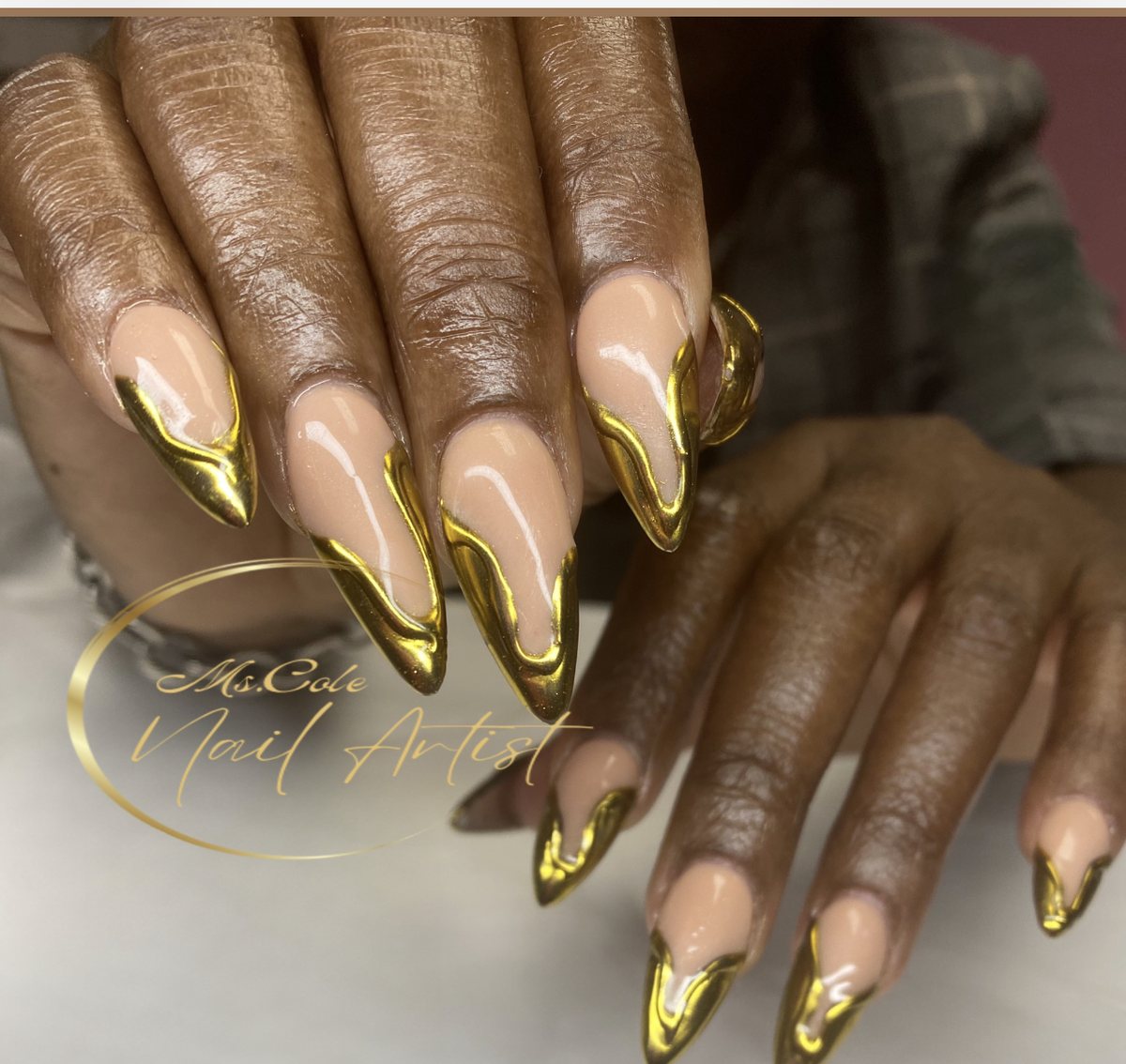 Almond nails with gold chrome french tips